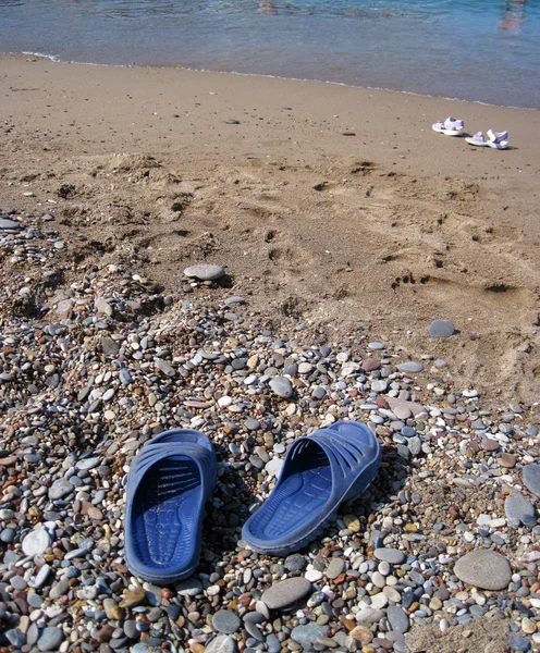 stock image Slippers on a sand