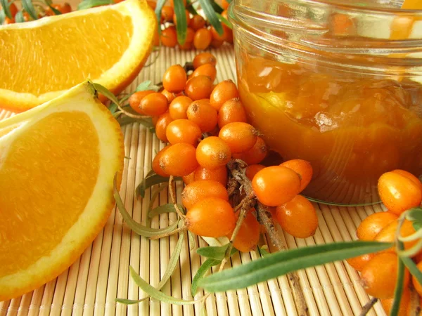 Jam with fruits of sea buckthorn and oranges — Stock Photo, Image