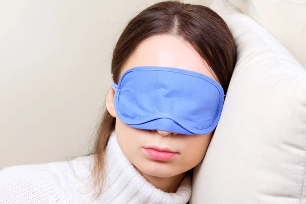 Woman wearing sleep mask