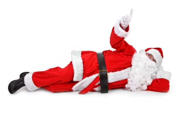 Санта указывает пальцем на предмет. — стоковое фото