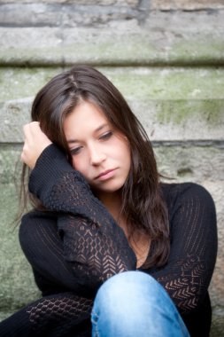 Teenage girl looking thoughtful about troubles clipart