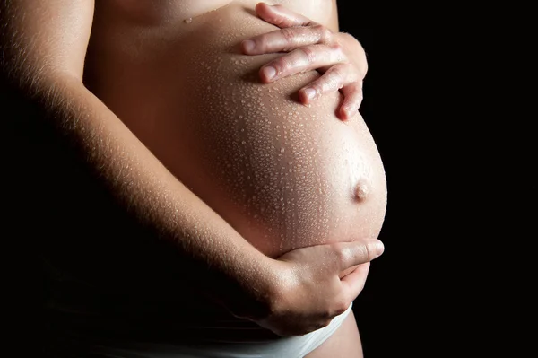 Belly of a beautiful pregnant woman — Stock Photo, Image