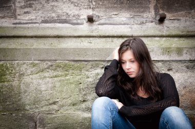 Teenage girl looking thoughtful about troubles clipart