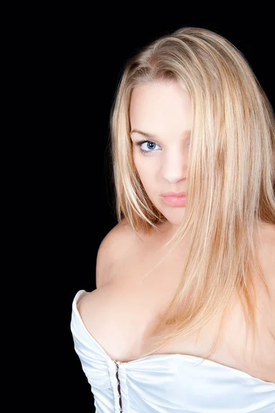 Portret van mooie blonde vrouw in witte korset — Stockfoto