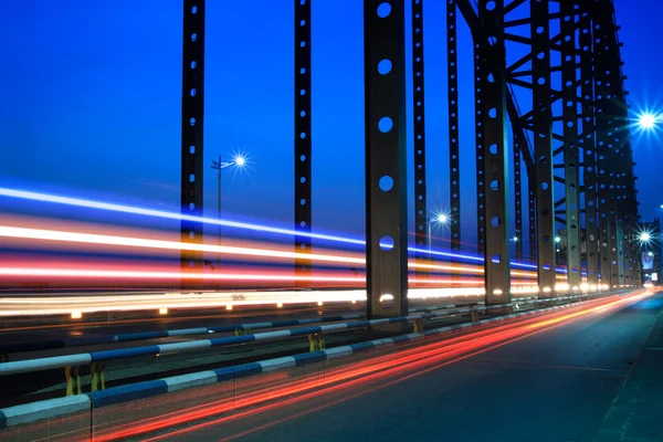 Light trails on the steel bridge — Stock Photo, Image
