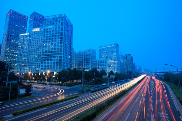 Light trails on the modern city at dusk in beijing,China