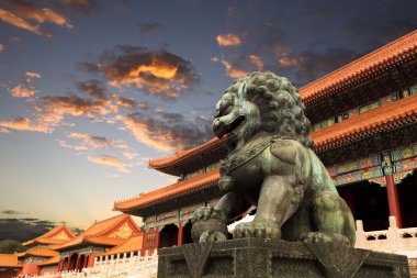 The forbidden city with sunset glow in beijing clipart