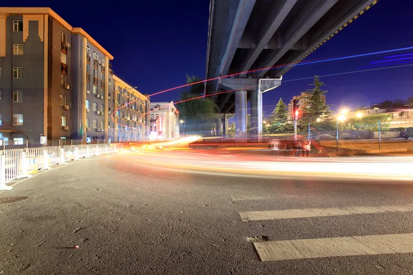 Light trails through the viaduct below — Stock Photo, Image