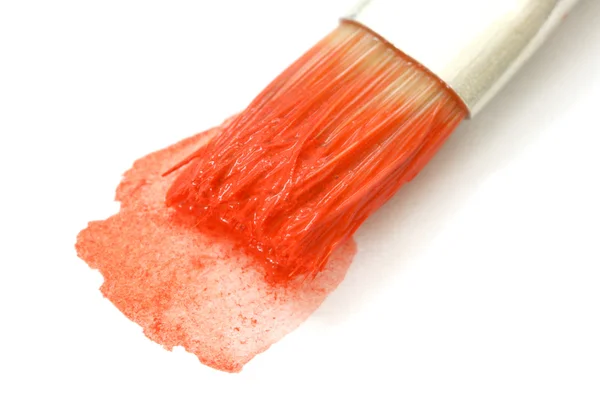 Brush in red water-color — Stockfoto