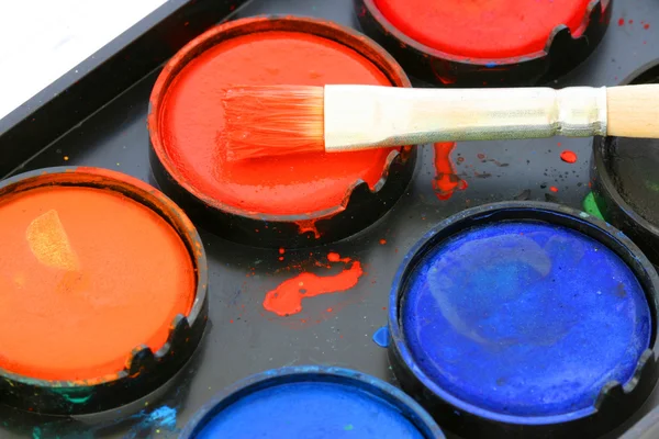 stock image Used water color paint box with a brush close up