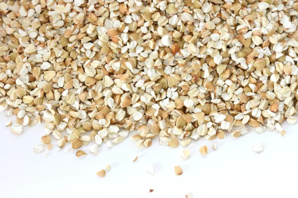 Dry raw buckwheat on white background — Stockfoto