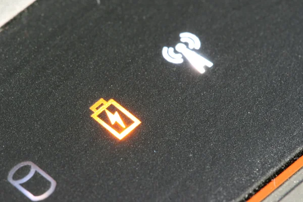 Orange low batter warning on a laptop — Stock Photo, Image