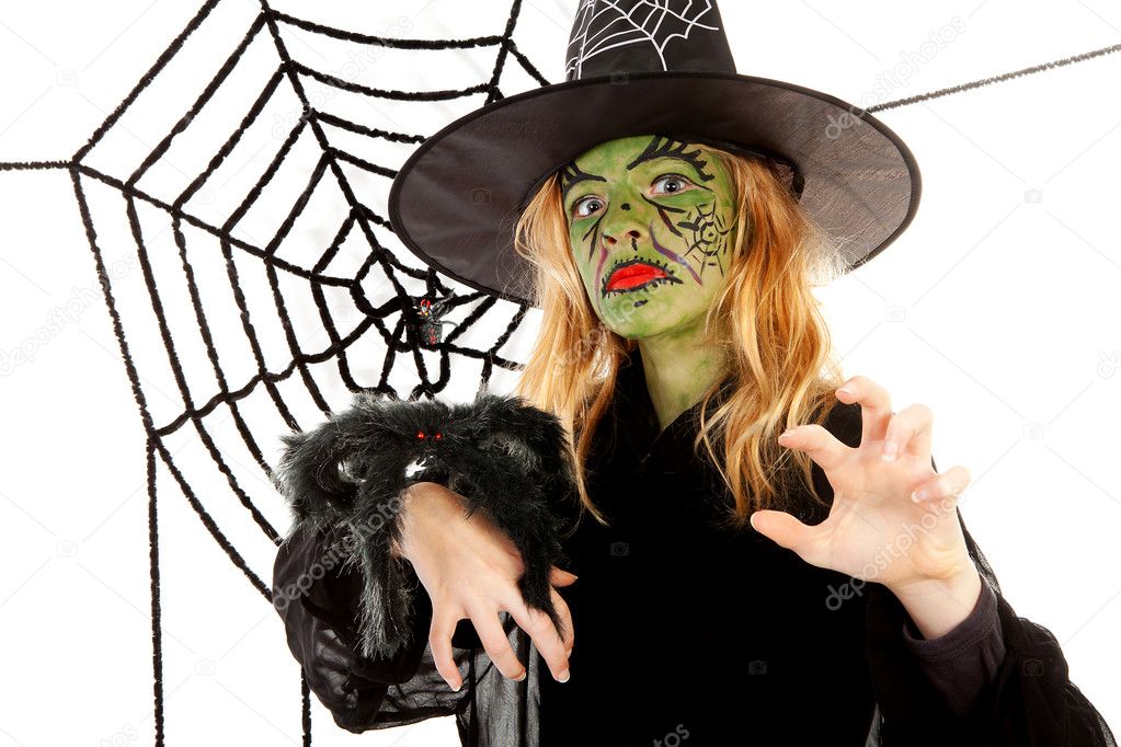 Scary little green witches for Halloween with spiderweb