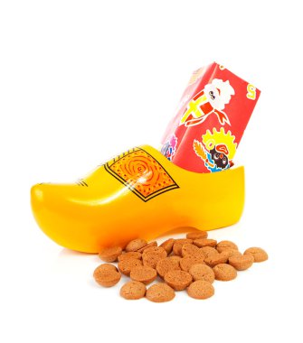 Dutch wooden shoe with presents and pepernoten clipart