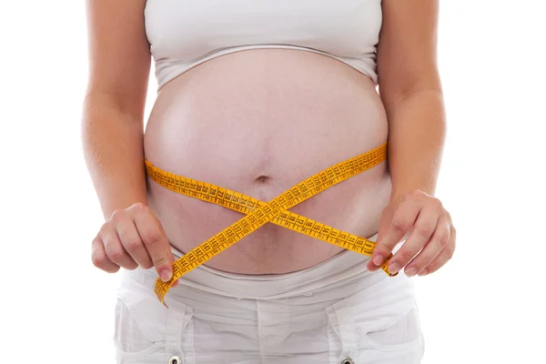 妊娠中の腹を測定 — ストック写真