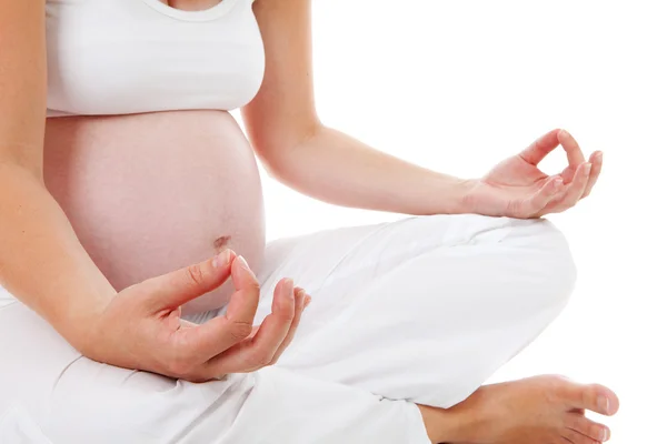 Closeup of woman doing meditative pregnancy yoga — Stock Photo, Image