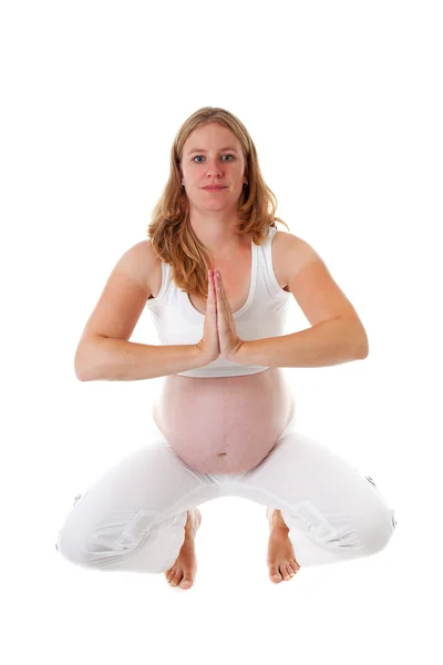 Woman doing meditative pregnancy yoga — Stock Photo, Image