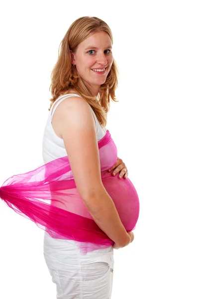 Femme enceinte avec tissu rose — Photo