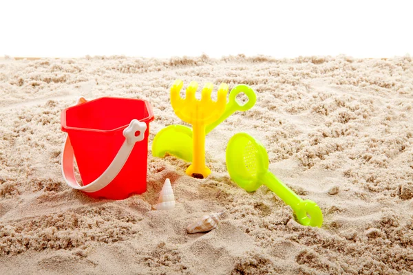 Plastic play toy on sand — Stock Photo, Image