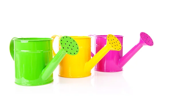Three colorful watering cans — Stock Photo, Image