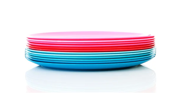 Pile of colorful plastic plates — Stock Photo, Image