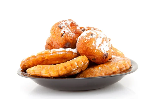 Prato com donut holandês e tornos de maçã — Fotografia de Stock