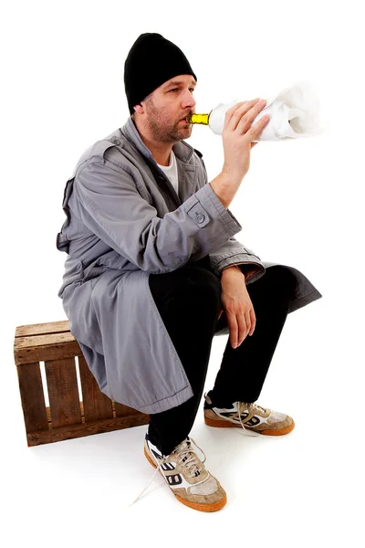 Male homeless tramp with empty bottle — Stock Photo, Image
