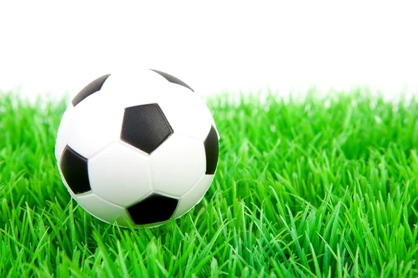 One soccer ball on plastic grass — Stock Photo, Image
