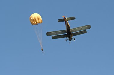 Paraglider pilots flying against clipart
