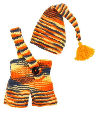 Set of kids knitted clothes: colorful baby's hat and pants. Over clipart