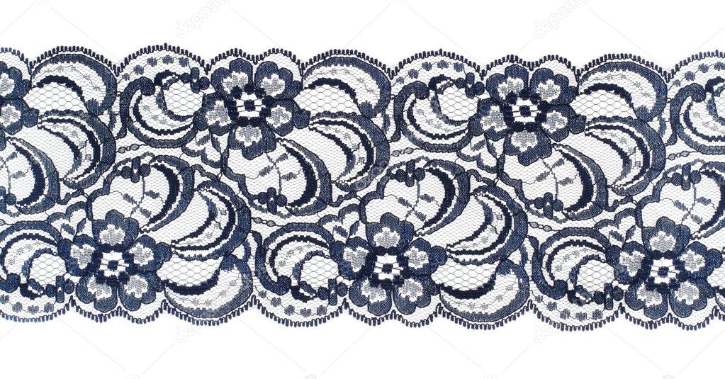 Lace trim ribbon over white. Embroidered fabric. Closeup
