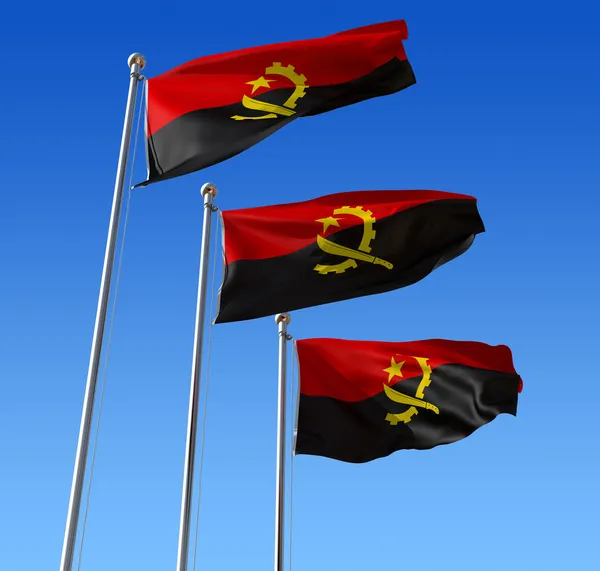 Три прапори Анголи проти синього неба. — стокове фото