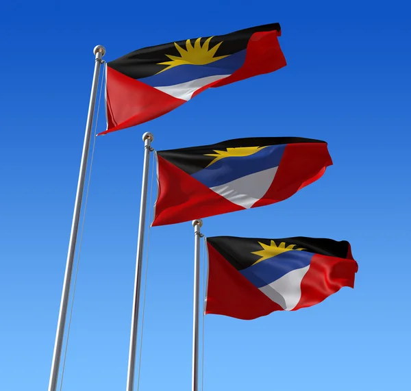 Three flags of Antigua and Barbuda against blue sky. — Stock Photo, Image