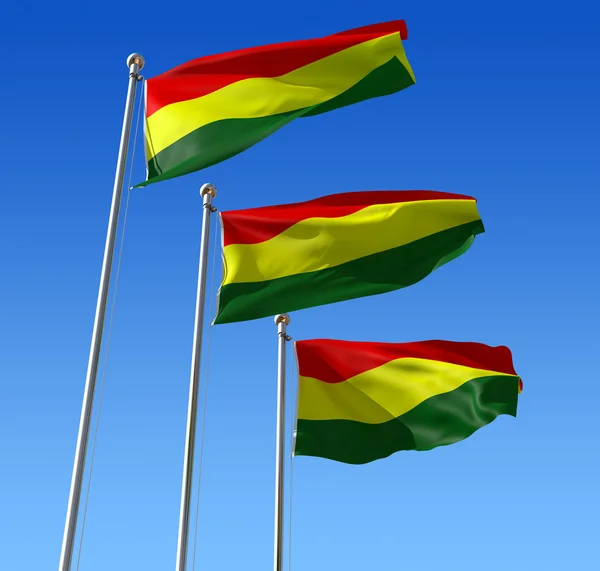 Trzy flagi Boliwii przeciw błękitne niebo. — Zdjęcie stockowe