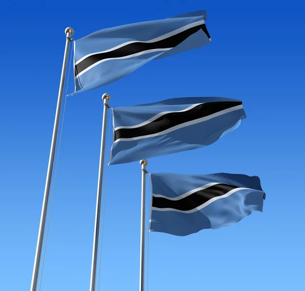 Three flags of Botswana against blue sky. — Stock Photo, Image