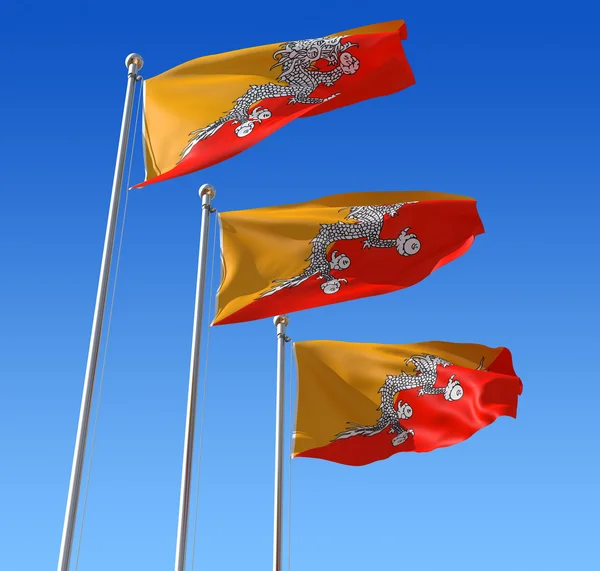 Tres banderas de Bután contra el cielo azul . — Foto de Stock