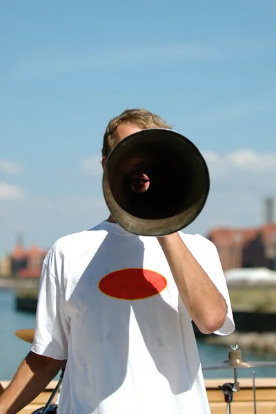 Man speaking in a megaphone — Stock Photo, Image