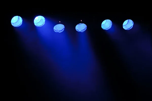 Blue spotlights and smoke — Stock Photo, Image