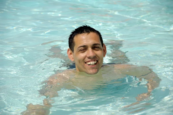 Happy man in pool — Stock Photo, Image