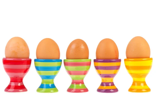 Colorful row with eggs in cups — Stock Photo, Image