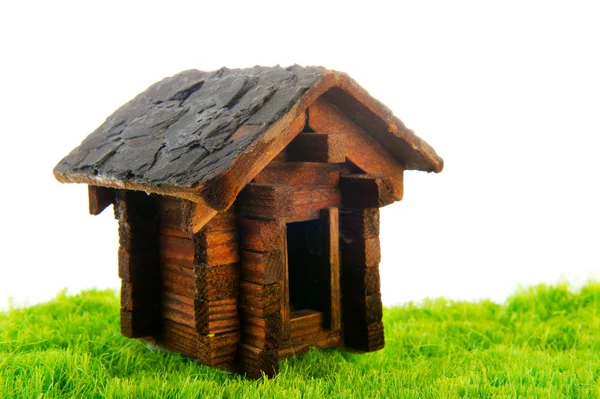 Wooden cabin in grass — Stock Photo, Image