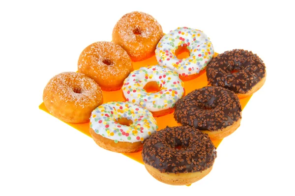 Сахарные пончики с цветной глазурью — стоковое фото