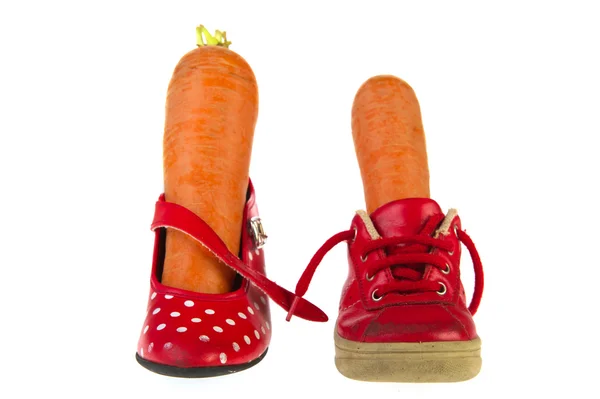 Schuhe mit Karotten — Stockfoto