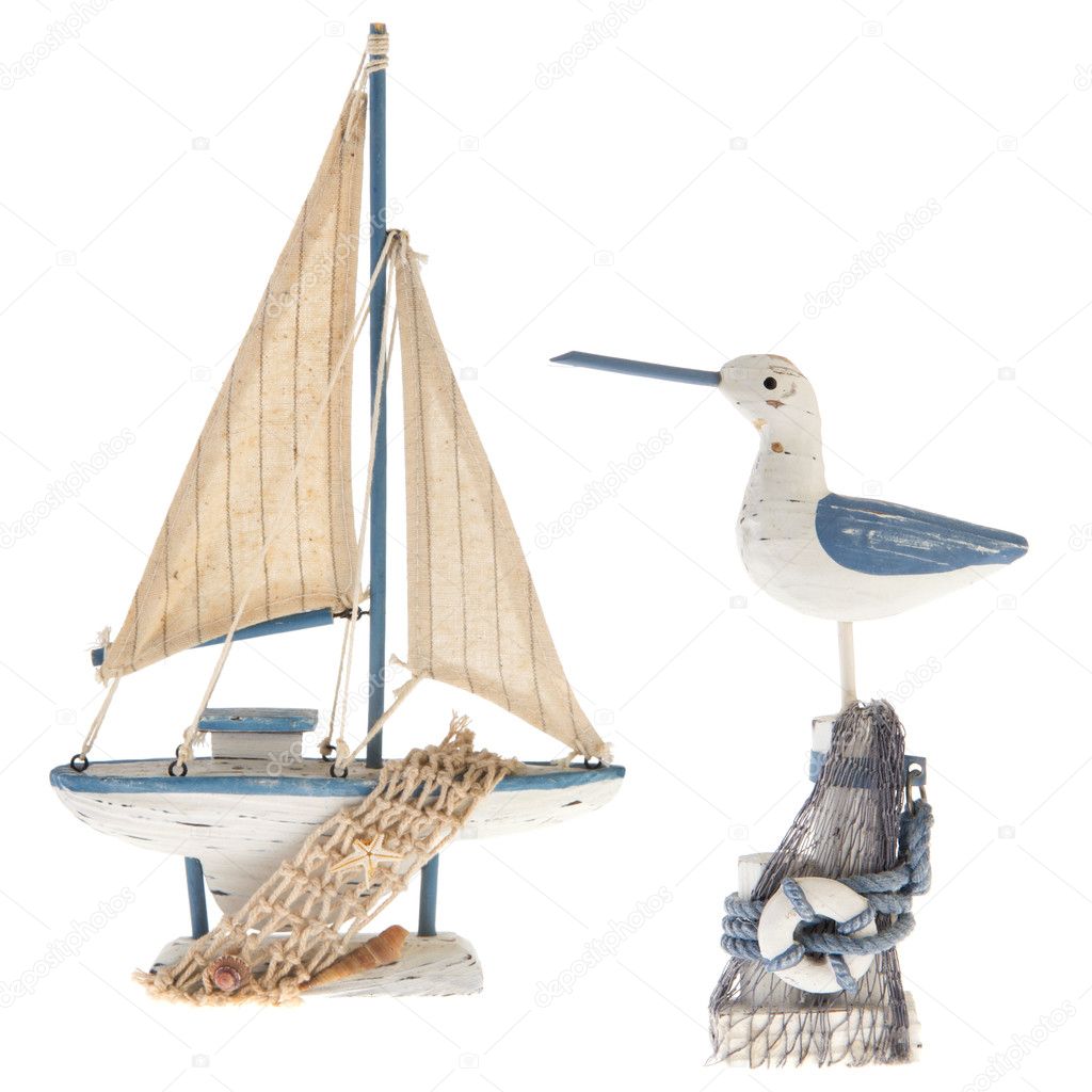 Old miniature sailboat and sea gull