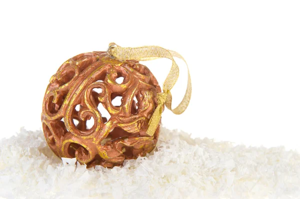 Golden Christmas balls in snow — Stock Photo, Image