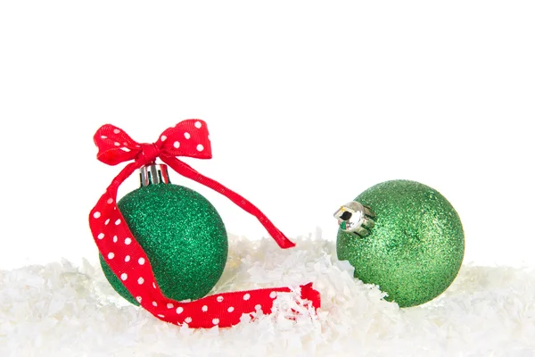 Green Christmas balls in snow — Stock Photo, Image