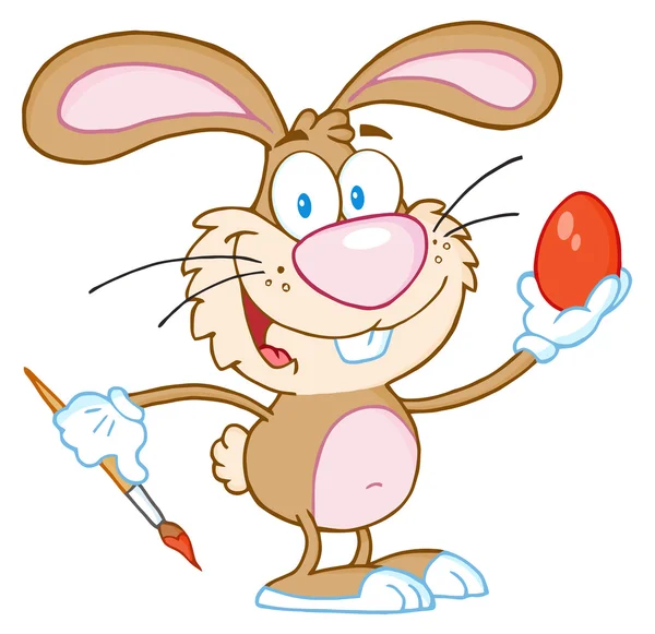 Brown Easter Bunny pittura un uovo — Foto Stock