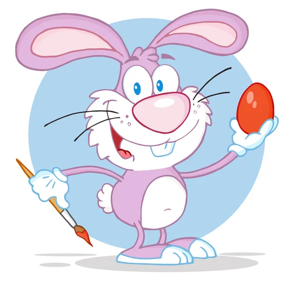 Šťastný růžový králík malování kraslic — Stock fotografie