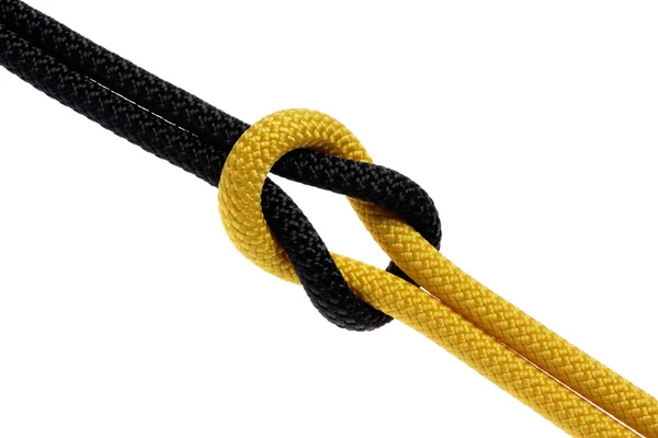 Reef-knot of black and yellow rope — Stock Photo, Image