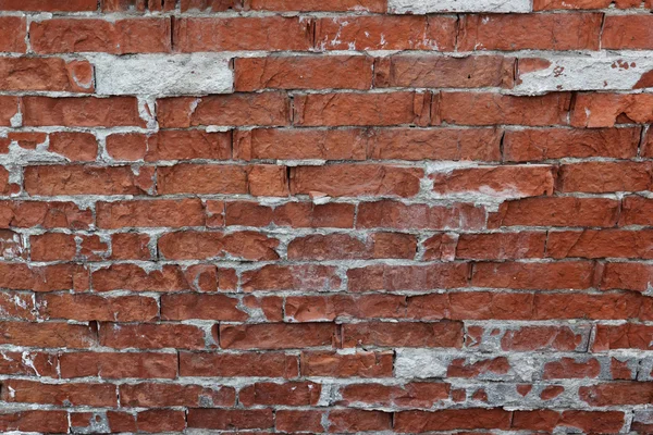 Velho fragmento de parede de tijolo resistido — Fotografia de Stock